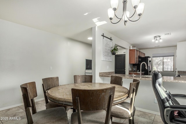 1940 W Expressman St, Apache Junction, AZ 85120 - dining space featuring a barn door, a chandelier, and light tile patterned floors