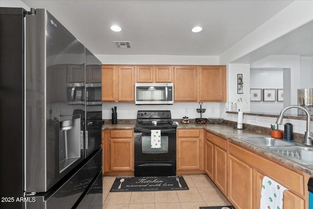 kitchen with stainless steel appliances, recessed lighting, visible vents, light tile patterned flooring, and a sink