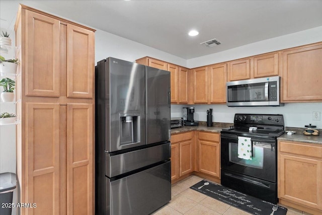 kitchen featuring light tile patterned floors, visible vents, dark countertops, appliances with stainless steel finishes, and recessed lighting