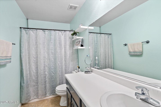 bathroom featuring visible vents, a shower with shower curtain, toilet, tile patterned floors, and vanity