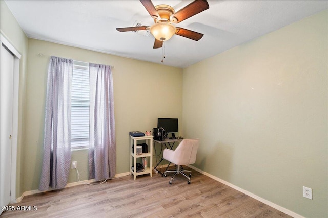 office area with ceiling fan, baseboards, and wood finished floors