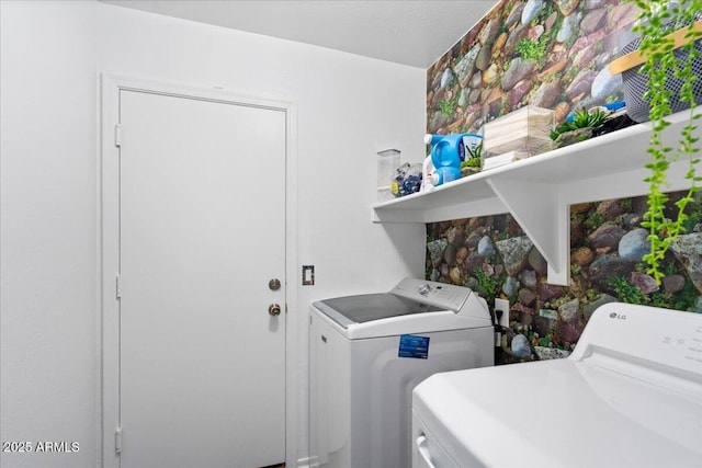 laundry room with washing machine and dryer and laundry area