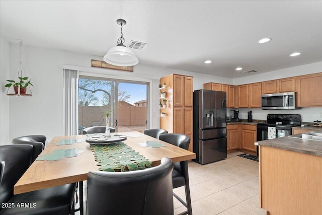 kitchen with black / electric stove, recessed lighting, visible vents, fridge with ice dispenser, and stainless steel microwave