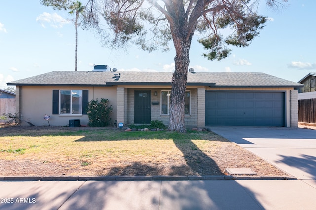 ranch-style house with a front yard and a garage