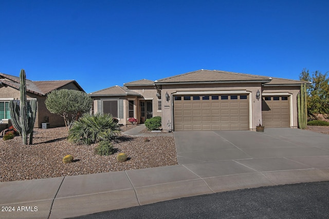 prairie-style home featuring a garage