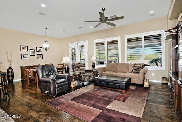 living room featuring dark hardwood / wood-style flooring and ceiling fan