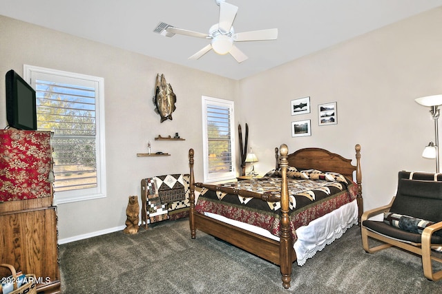 bedroom featuring ceiling fan and dark carpet