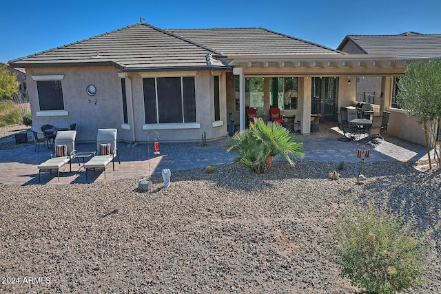 rear view of property with a patio