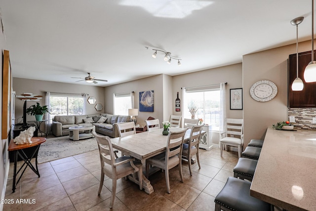 tiled dining room with ceiling fan