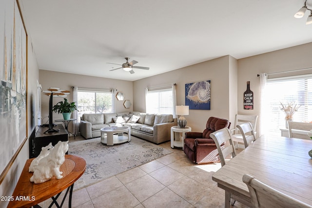 tiled living room featuring ceiling fan