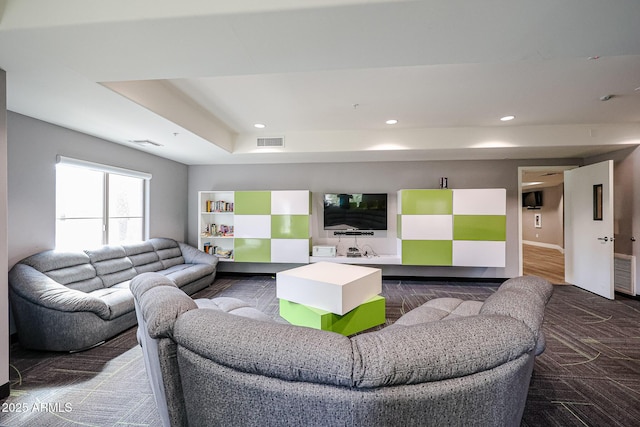 living room featuring a tray ceiling