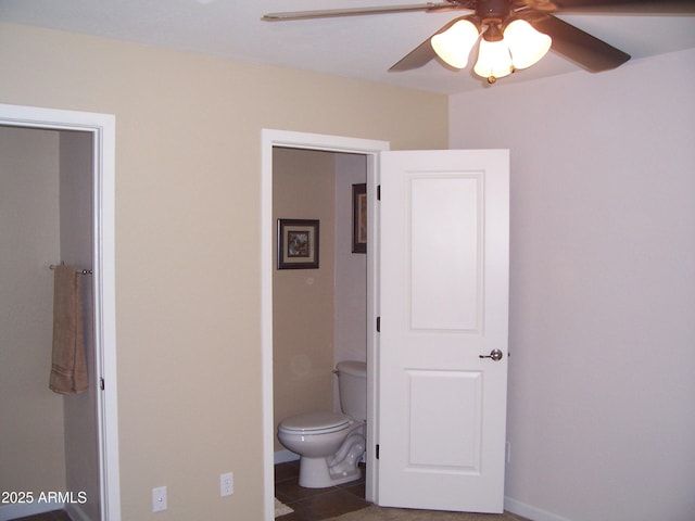 bathroom with ceiling fan, toilet, and tile patterned floors