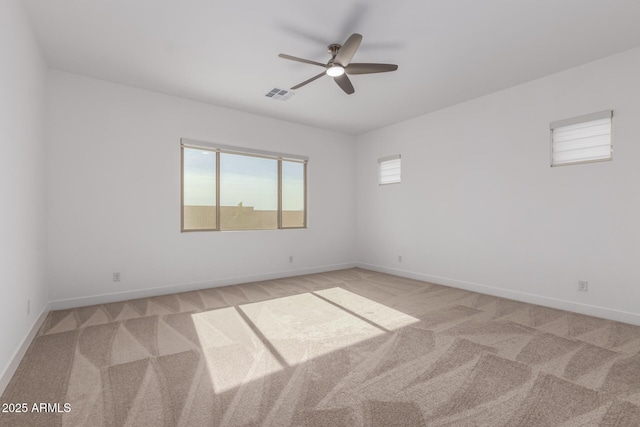 carpeted empty room with ceiling fan