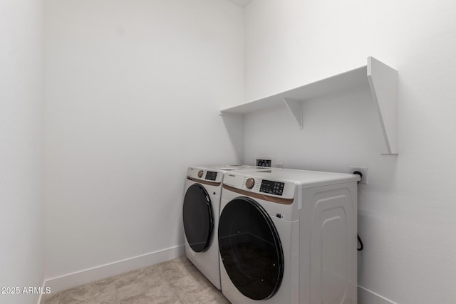 laundry room with independent washer and dryer