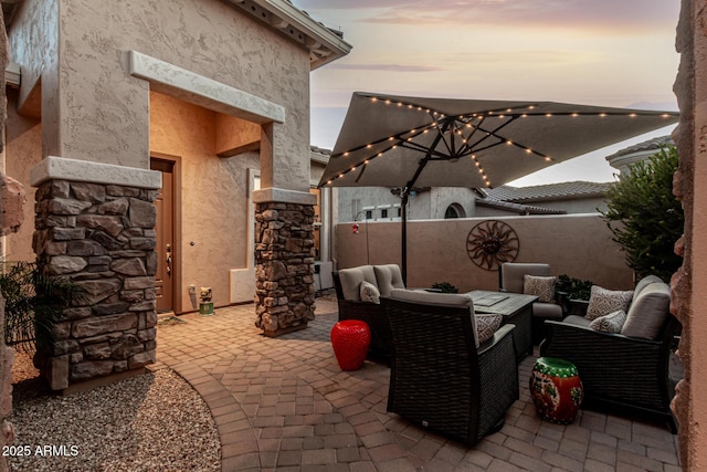 patio terrace at dusk with an outdoor hangout area