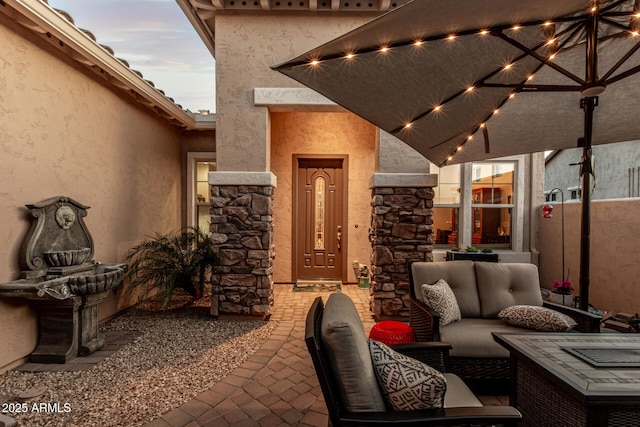 patio terrace at dusk with outdoor lounge area