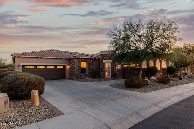 view of front of property with a garage