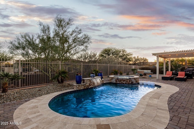 pool at dusk with an in ground hot tub, outdoor lounge area, a patio, pool water feature, and a pergola