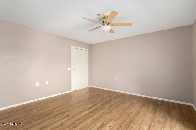 spare room with ceiling fan and light hardwood / wood-style floors