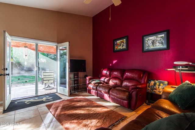 tiled living room featuring ceiling fan