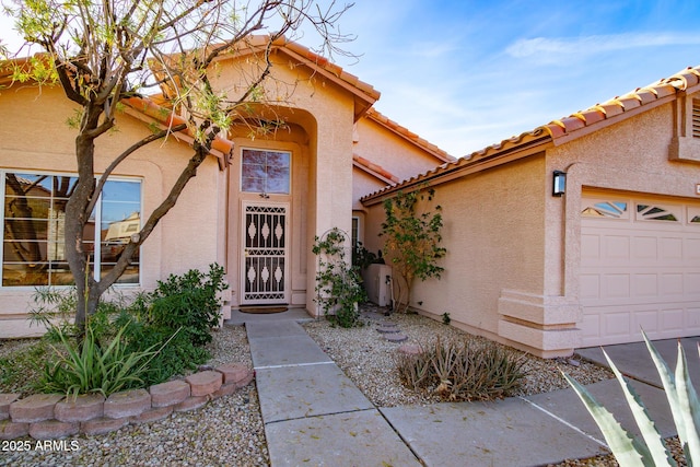 doorway to property featuring a garage