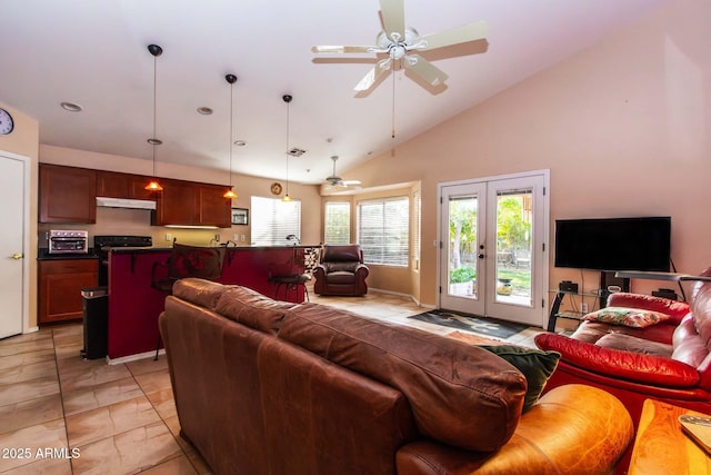 living room with high vaulted ceiling, ceiling fan, and french doors