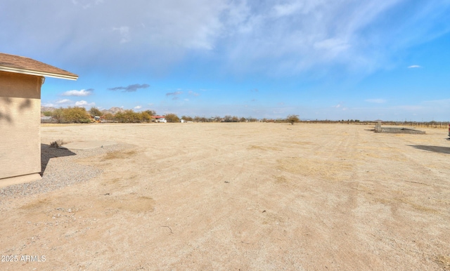 view of yard with a rural view