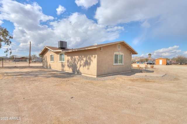 back of property with central AC unit