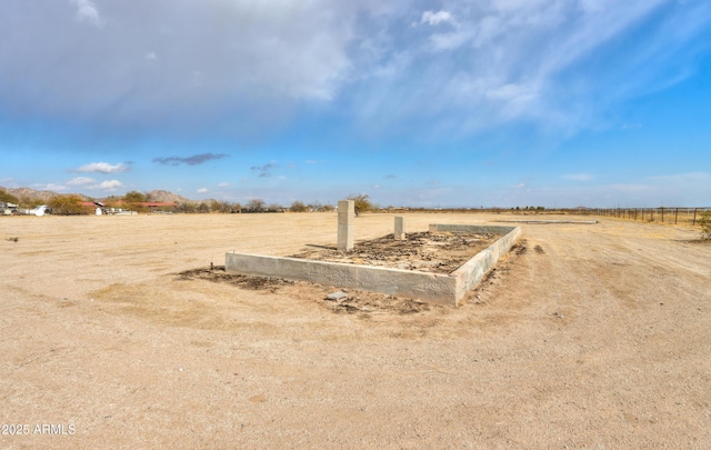 view of yard with a rural view