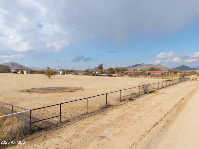 view of yard featuring a mountain view and a rural view