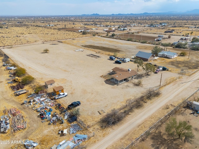 birds eye view of property with a rural view