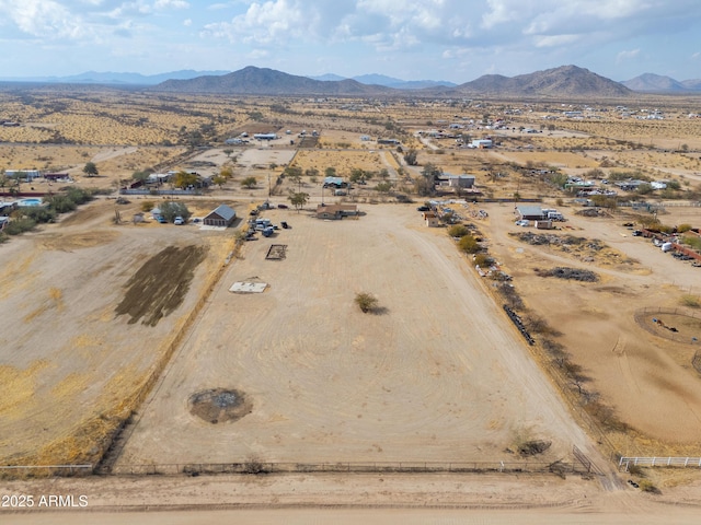 birds eye view of property featuring a mountain view