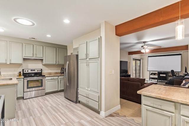 kitchen featuring stainless steel appliances, open floor plan, a sink, ceiling fan, and recessed lighting