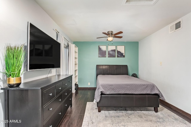 bedroom featuring dark wood-style flooring, baseboards, and ceiling fan