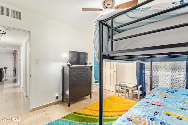 bedroom with tile patterned floors and baseboards