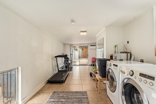 laundry room with independent washer and dryer, light tile patterned flooring, water heater, and a wall unit AC