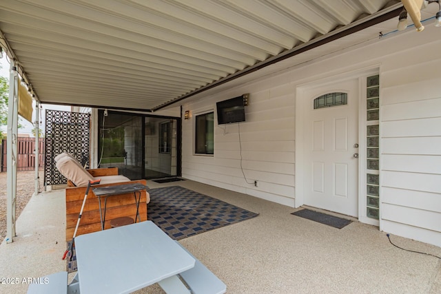 view of patio / terrace featuring fence
