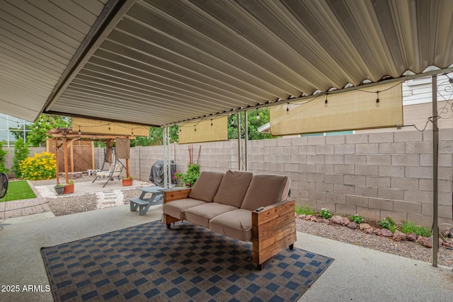 view of patio with outdoor lounge area and a fenced backyard