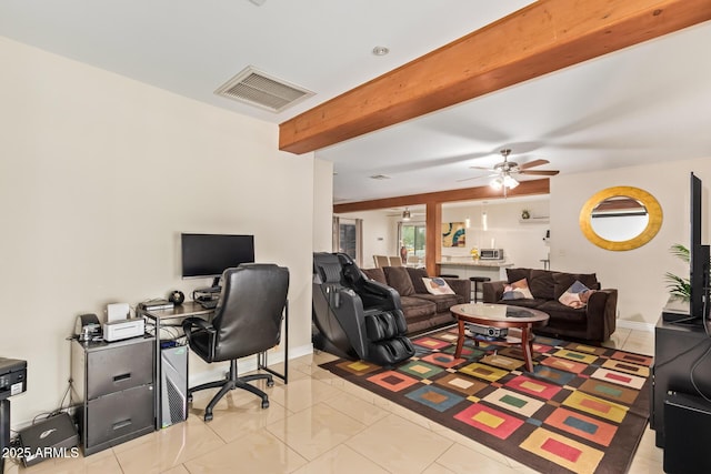office space featuring a ceiling fan, beam ceiling, and baseboards