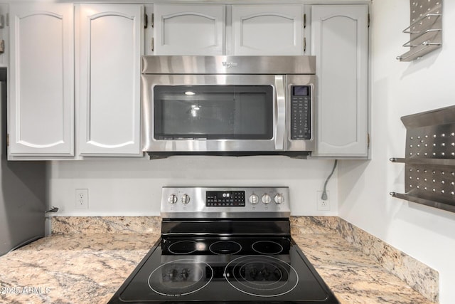 2059 E Brown Rd Unit 35, Mesa, AZ 85213 - kitchen view of appliances with stainless steel finishes and white cabinets