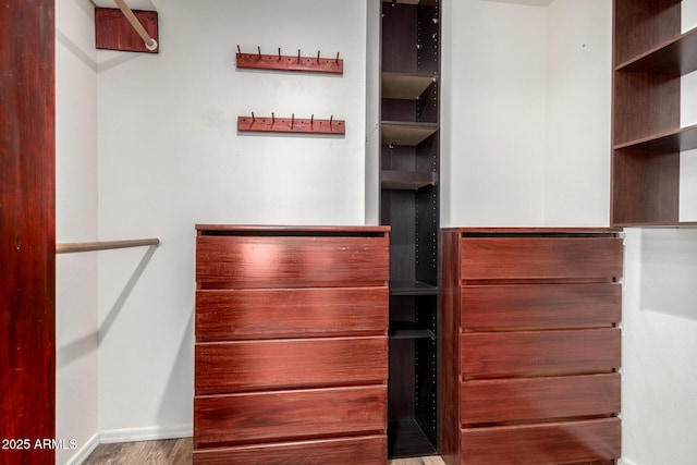 2059 E Brown Rd Unit 35, Mesa, AZ 85213 - spacious closet featuring wood finished floors