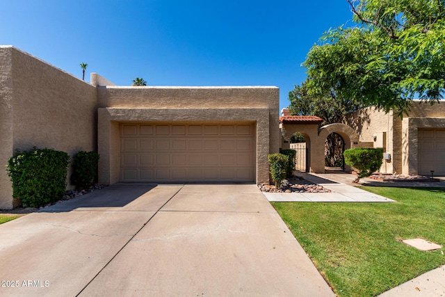 2059 E Brown Rd Unit 35, Mesa, AZ 85213 - adobe home with stucco siding, an attached garage, concrete driveway, a front yard, and a tiled roof