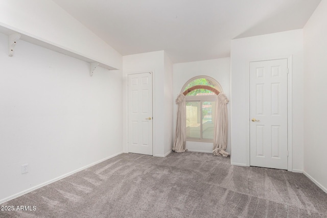 2059 E Brown Rd Unit 35, Mesa, AZ 85213 - carpeted spare room with baseboards and vaulted ceiling