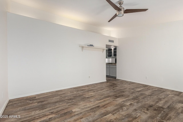 2059 E Brown Rd Unit 35, Mesa, AZ 85213 - empty room with ceiling fan and dark wood-style flooring