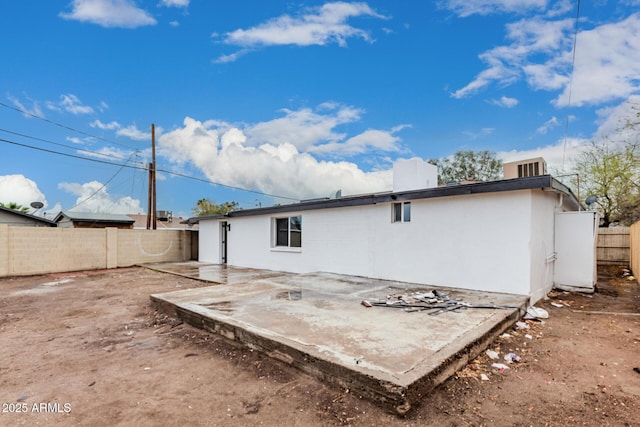 back of property featuring a patio area, a fenced backyard, and stucco siding