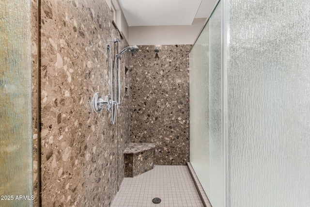 bathroom featuring a shower stall and tile patterned flooring