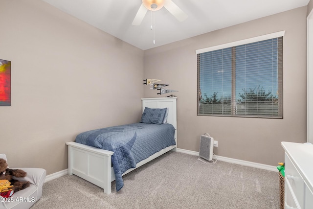 bedroom with carpet flooring, ceiling fan, and baseboards