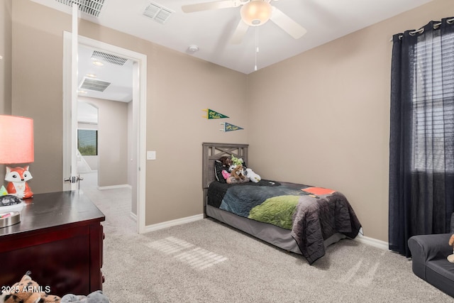 bedroom with light colored carpet, visible vents, and baseboards