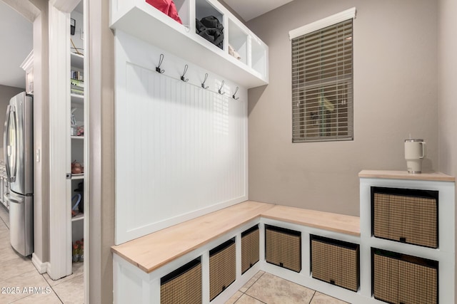 mudroom with light tile patterned floors