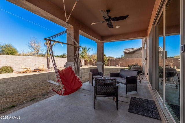 view of patio / terrace featuring ceiling fan, an outdoor hangout area, and a fenced backyard